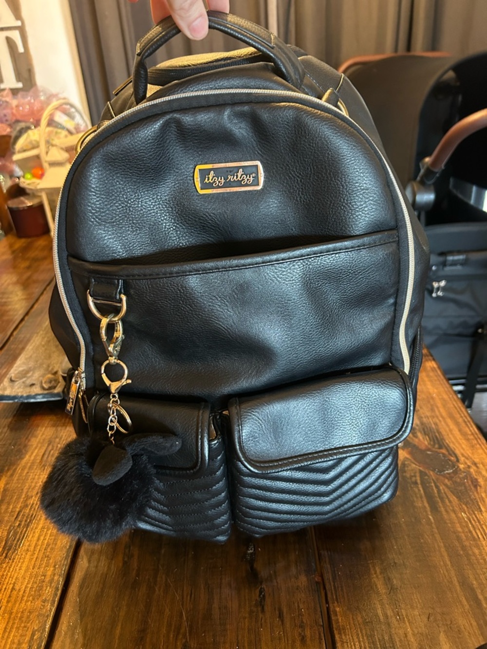 Itzy Ritzy Black Faux Leather large diaper bag backpack with Gold Logo Plate